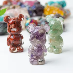 Close-up of crystal resin bear figurines filled with natural amethyst and gemstones