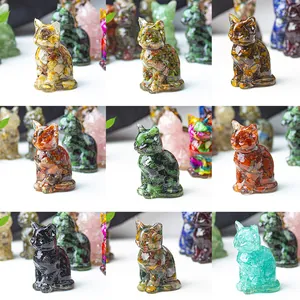 Detail view of various crystal resin lucky cat figurines with different gemstone textures