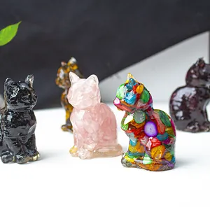 Detailed close-up of handmade resin lucky cat figurines with assorted crystal fillings