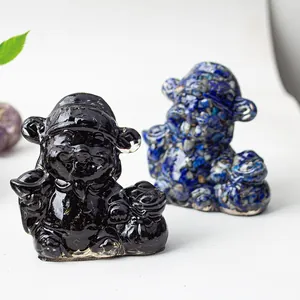 Detailed close-up of resin God of Wealth statues with natural crystal stone textures