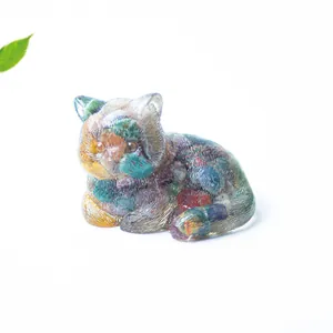 Macro detail of a transparent resin cat figurine filled with colorful crystal stones