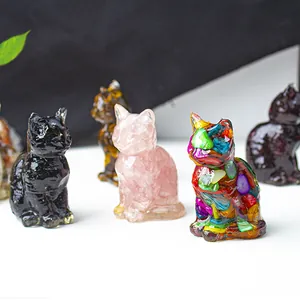 Detailed macro view of resin cat statues with crushed stones in various colors