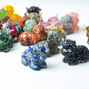 Detail view of colorful resin Highland Cow figurines with natural stone textures on white