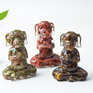 Three meditating dog figurines with natural crystal stones embedded in clear resin decor