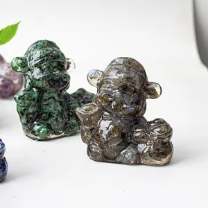 Macro shot of hand-carved Labradorite and Ruby in Zoisite crystal figurine decor
