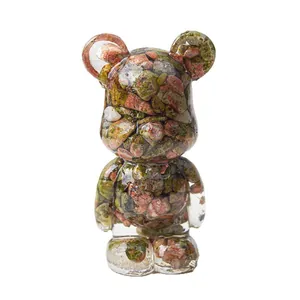 Modern crystal bear figurine made of transparent resin with natural colorful stones