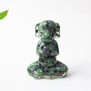 Detail of meditation dog statue made of ruby zoisite natural stone for home decor