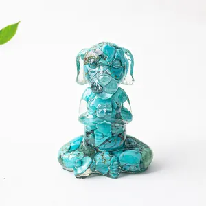 Macro detail of meditating dog figurine made with turquoise stone chips and clear resin
