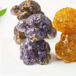 Close-up of resin dog figurine with purple crystal stones and shiny gold foil flakes