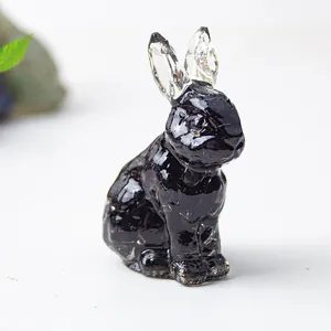 Detail shot of crystal rabbit ornament with dark resin body and transparent ears