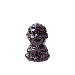 Meditating monk statue made of purple natural crystal resin for zen desk decoration