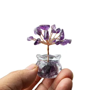 Miniature amethyst crystal money tree with copper wire in a small glass jar display