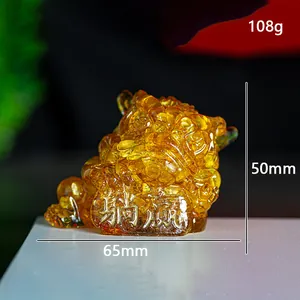 Translucent golden resin three-legged toad crystal statue measuring 65x50mm and 108g