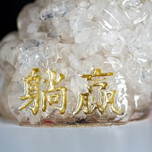 Three-legged golden toad resin ornament filled with clear white natural crystals