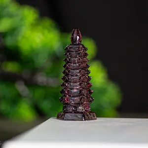 Macro shot of dark red crystal Wenchang Tower with detailed resin tiers and base
