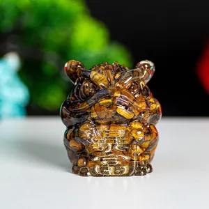 Close-up of tiger eye stone tiger figurine holding a lucky plaque in resin finish