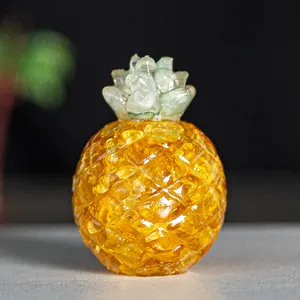 Golden resin pineapple ornament with natural crystal filling and realistic leaf textures