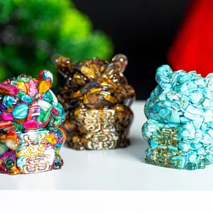 Close-up of three crystal resin tiger statues with Chinese wealth symbol engravings
