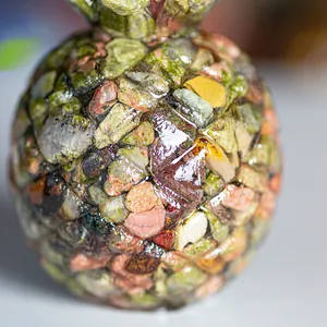 Macro shot of resin pineapple ornament showing detailed texture of natural crystal stones