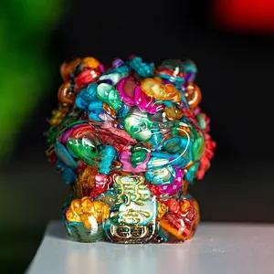 Detail of colorful resin cat figurine with mosaic crystal stones and golden Fu character