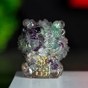 Macro shot of purple and green resin stone guardian lion statue with gold rich engraving