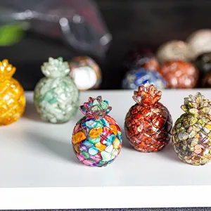 Detailed macro view of pineapple figurines filled with colorful natural crystal stones