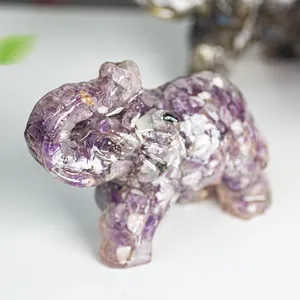 Macro detail of the purple crystal chips embedded in the resin elephant statue