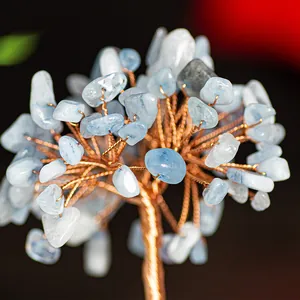 Macro shot of handcrafted copper wire branches with light blue crystal stone leaves
