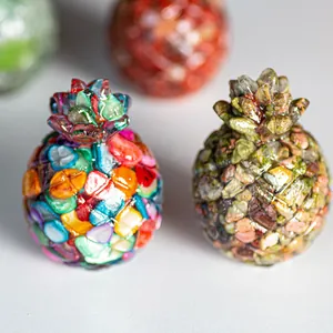 Close-up of resin pineapple ornaments with colorful natural crushed stone mosaic textures