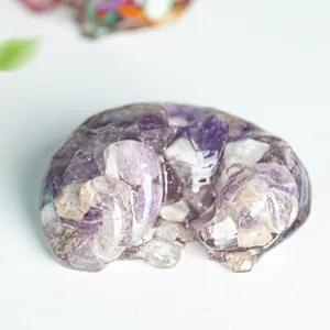 Macro detail of a sleeping labrador resin statue filled with natural purple amethyst stones