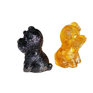 Schnauzer-Figuren aus Harz mit Kristallfüllung in Schwarz und Bernstein-Goldtönen