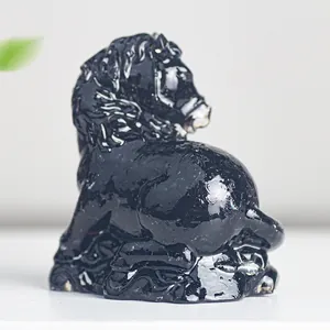 Macro shot of black glossy resin horse figurine with a reflective mirror finish