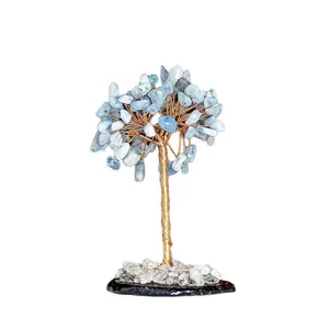 Handmade light blue crystal tree of life with gold wire branches and white stone base