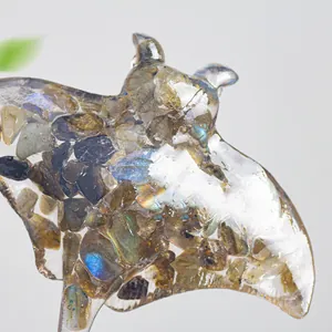 Macro detail of natural labradorite stones inside a resin manta ray sculpture