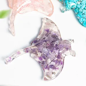 Top view of manta ray resin sculptures filled with amethyst and rose quartz crystals