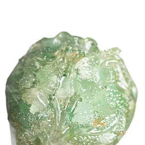 Handcrafted translucent green crystal cabbage ornament with detailed natural textures