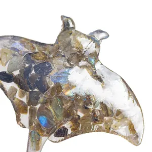 Resin manta ray sculpture filled with natural labradorite showing blue metallic luster