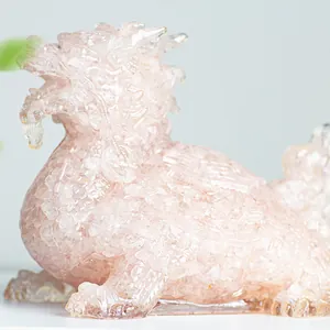 Detailed macro view showing the pink crystal texture and resin carving of the turtle dragon