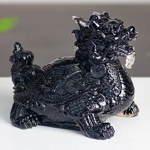 Detailed view of the intricate shell textures on a polished black resin dragon turtle