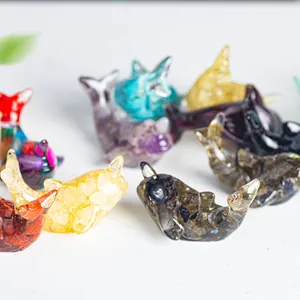 Macro shot of colorful resin whale ornaments with embedded natural crystal stones