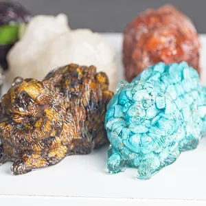 Detail of four colorful resin pomeranian crystal statues with textured fur carving