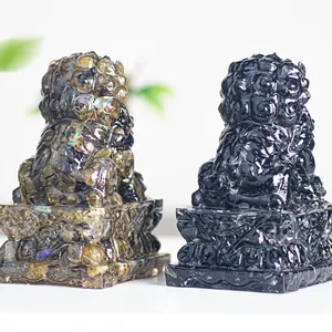 Pair of resin-filled natural crystal lion statues with labradorite and obsidian finish