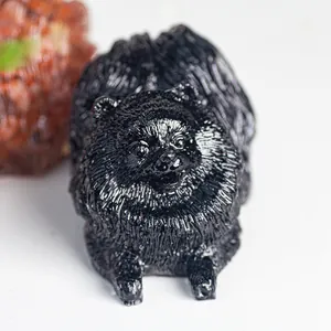 Detailed view of black resin Pomeranian figurine with realistic fur textures