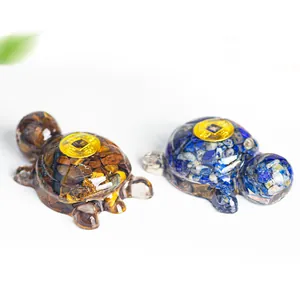 Macro detail of resin turtle statues with natural crystal stones and lucky coins