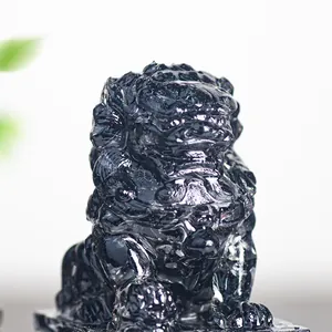 Macro shot of black crystal resin Pixiu sculpture with fine details and polished finish
