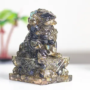 Detailed view of hand-carved Labradorite stone lion with blue flash and floral base