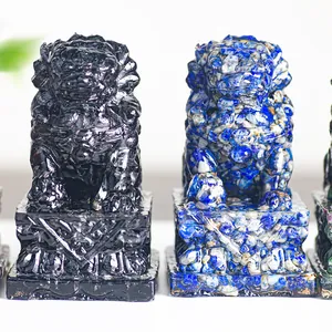 Macro detail of obsidian and lapis lazuli resin guardian lion statues on carved bases