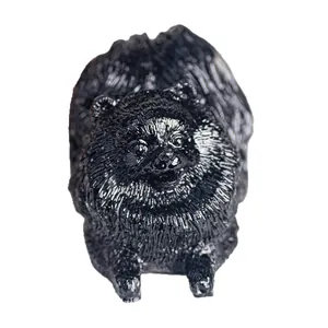 Black resin Pomeranian dog figurine with detailed fur texture for home desk decoration
