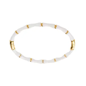 Bracelet jonc style bambou en acier inoxydable doré avec détails en émail blanc