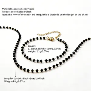 Macro detail of beaded stainless steel necklace and bracelet set with lobster clasp